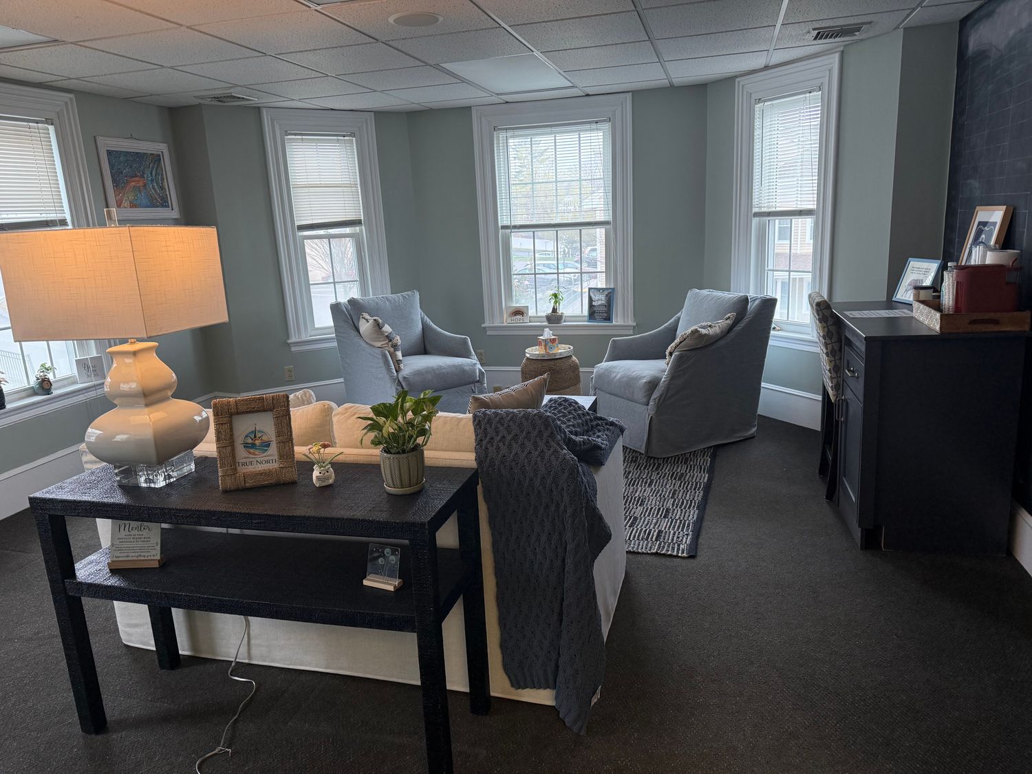 True North Counseling office in Plymouth MA showing cozy seating area and True North branded decor