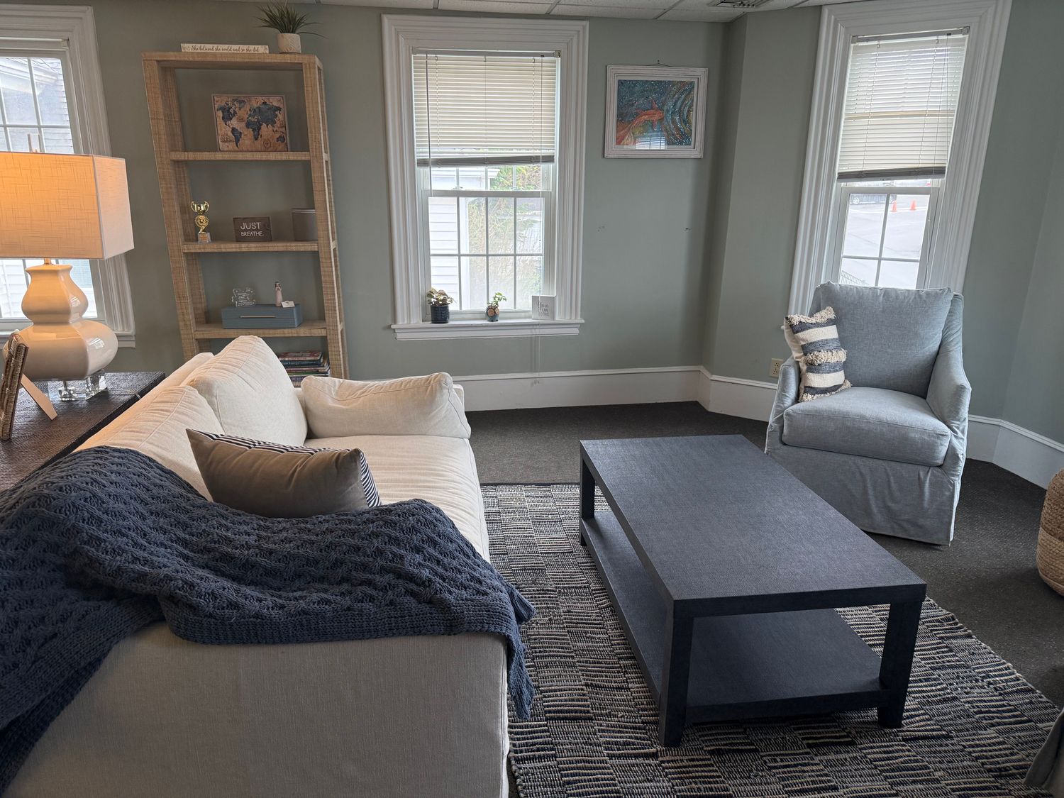 Private therapy session room at True North Counseling Plymouth MA with armchairs, chalkboard wall, and calming decor